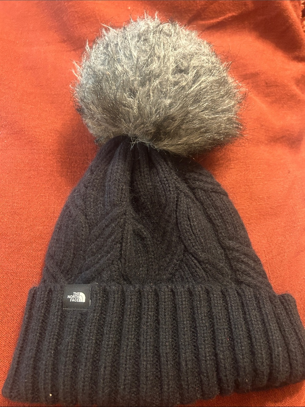 The North Face Black Cable-Knit Beanie with Gray Faux Fur Pom